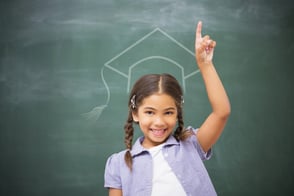 Child raising their hand to ask a question